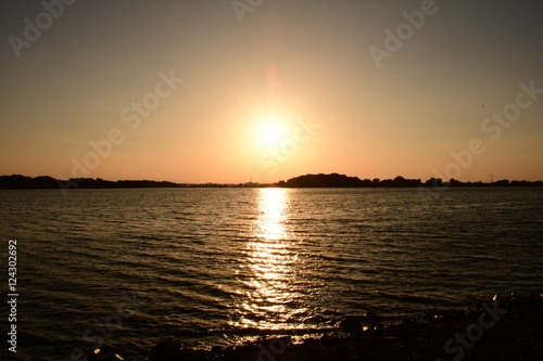 Sunset on Tatebayashi Tatara Swamp in Japan. Tatara Swamp is famous in Japan. photo