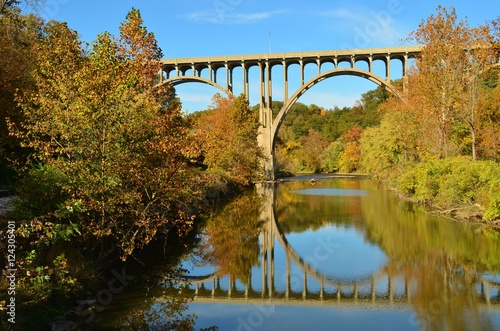 bridge overpass and reflection on lake in Autumn