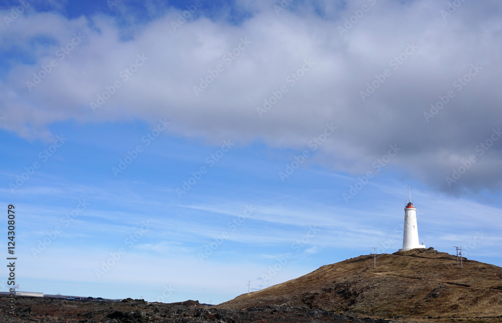 Obraz premium Beautiful Meadow landscape on the road with lighthouse backgroun