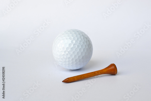golf ball and wooden golf tees on white background, sport time