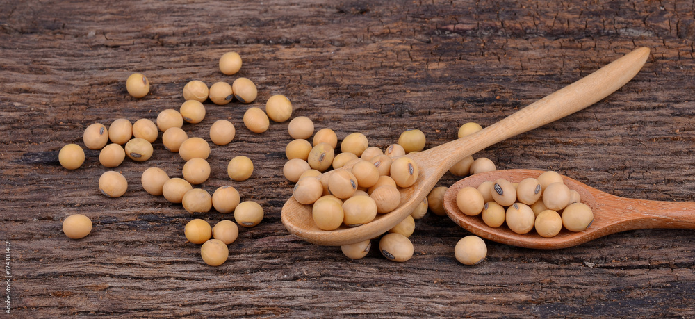 Soybean spoon on old wooden Soybean spoon on old wooden