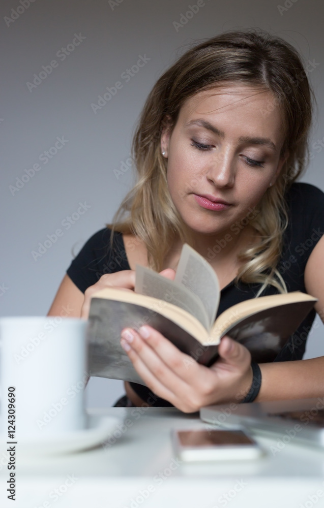 cheerful young woman studying