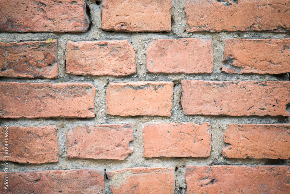 Old, crumbly and burnt bricks wall. Background. Old, crumbly and burnt bricks wall. Background.