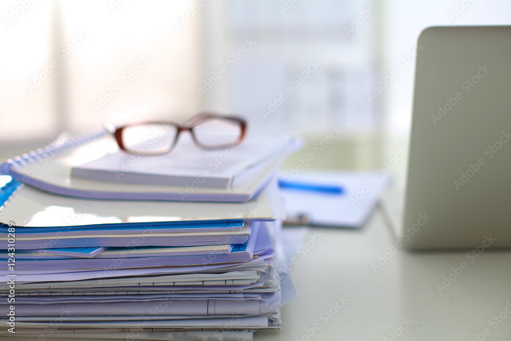 office desk a stack of computer paper reports work forms office desk a stack of computer paper reports work forms