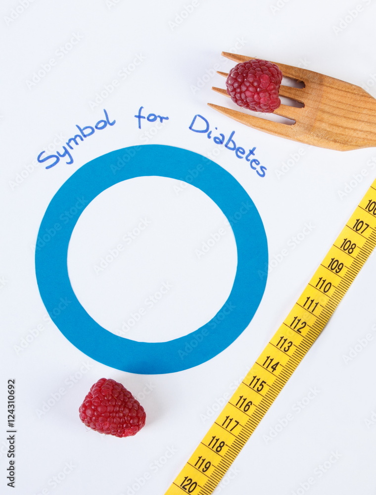 Symbol of world diabetes day and fresh raspberries with centimeter