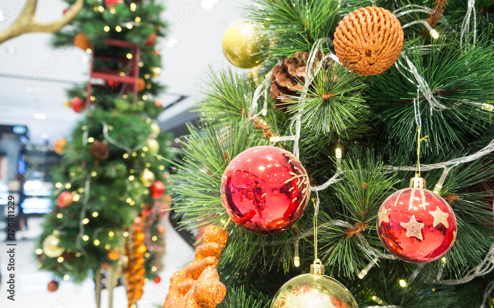 Fototapeta premium Decorated Christmas tree on blurred background. End of year celebration.