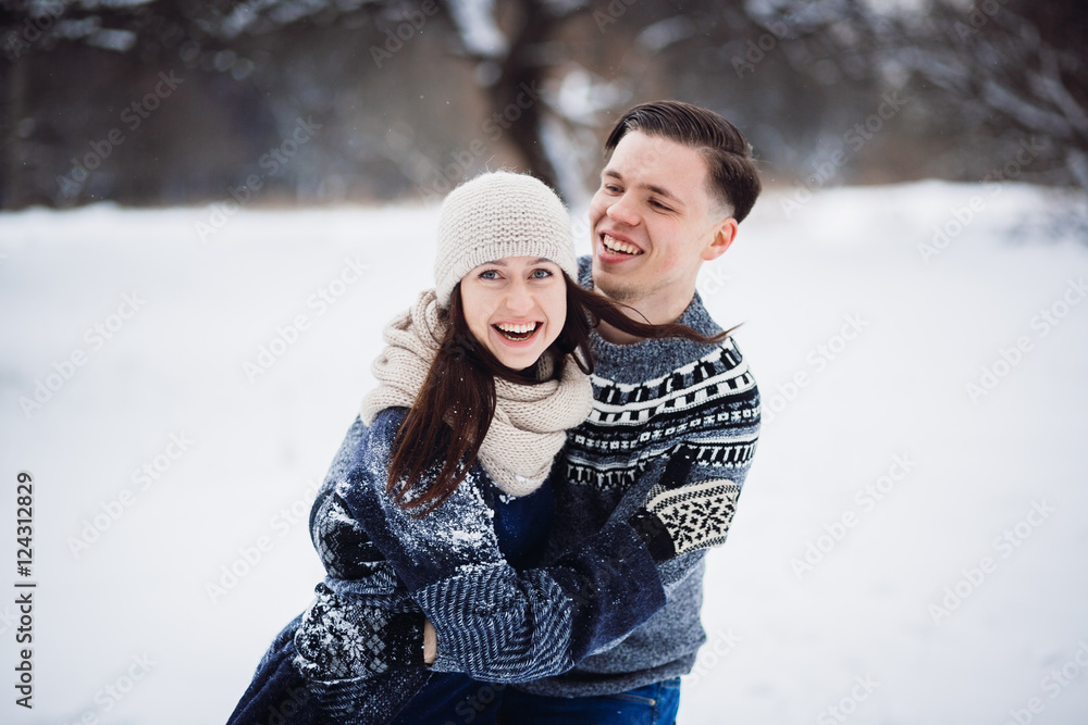Winter couple having fun in snow park. Winter couple having fun in snow park.