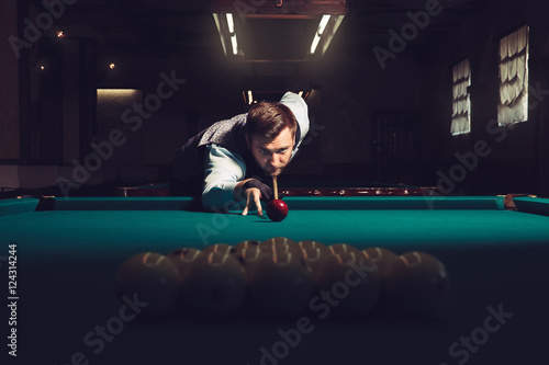 Man playing billiard photo