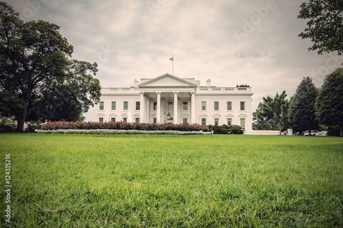 The White House in Washington D.C. at a cloudy day, green lawn in foreground, Executive Office of the President of the United States, USA, vintage filtered style