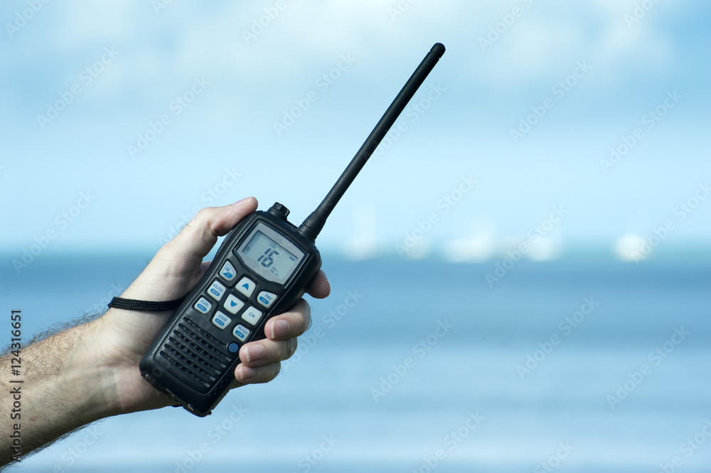 Man holding a two way radio foto de Stock | Adobe Stock