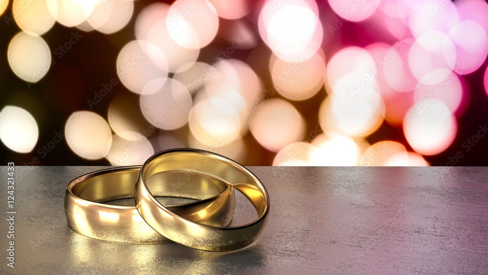 Two golden wedding rings on black table colored bokeh background Two golden wedding rings on black table colored bokeh background