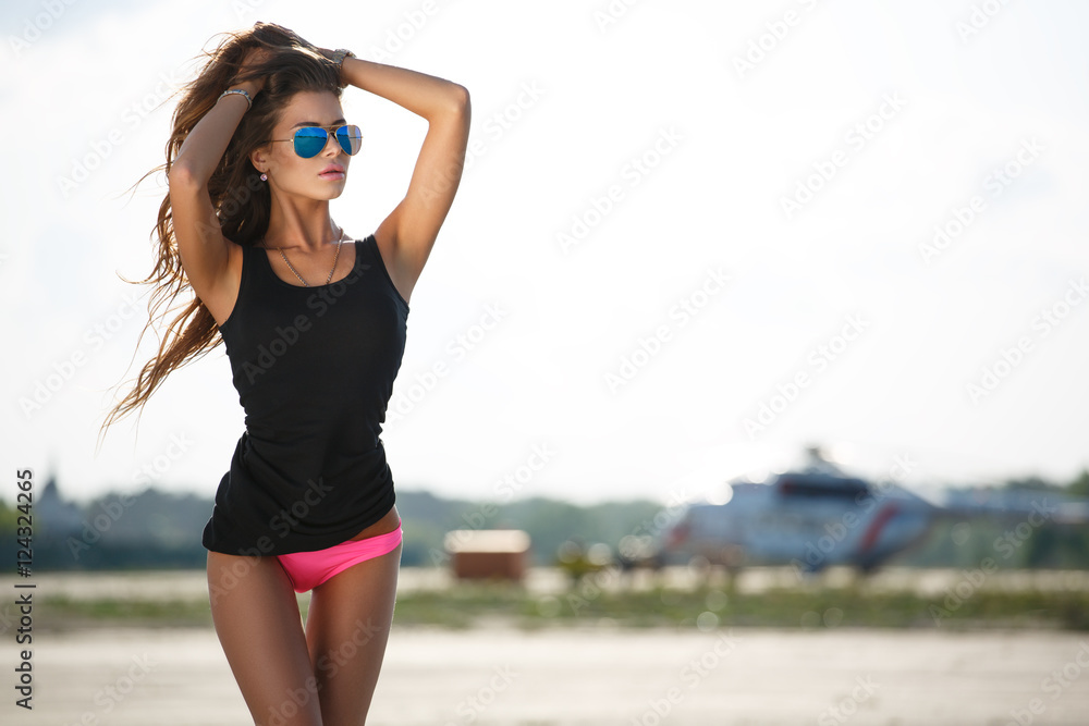 Posh appealing girl with slim sun tanned body and beautiful