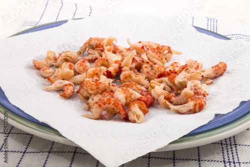 Tableau sur toile cleaned and cooked crayfish tails with white kitchen paper on a