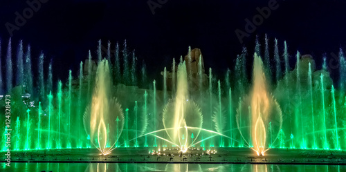 Musical fountain with colorful illuminations at night. 