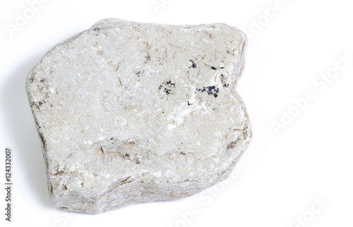 Single natural stone on white background