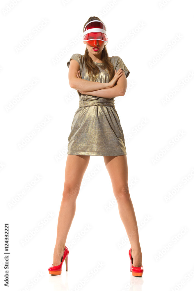 Serious Fashion Model In Red High Heels And Gold Mini Dress Serious Fashion Model In Red High Heels And Gold Mini Dress