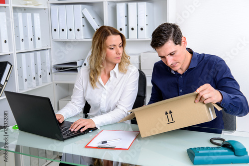 businessman and businesswoman with delivery in the office