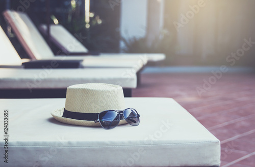 Hat and sunglasses at the pool.