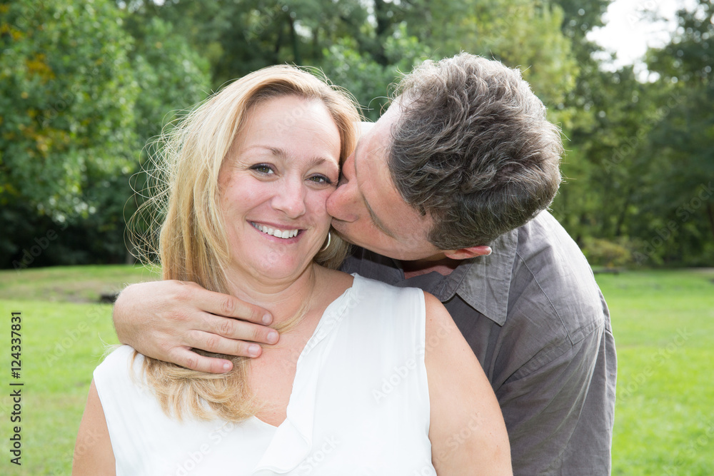 Happy mature couple in love, man is kissing his wife . Stock Photo | Adobe  Stock