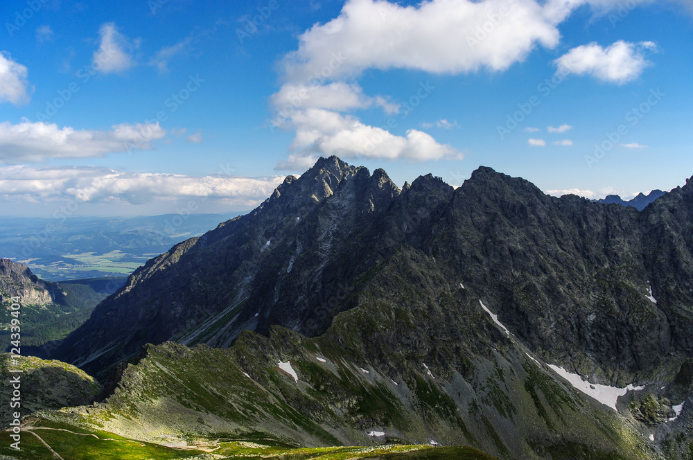 Panorama of amazing summer mountains under blue sky