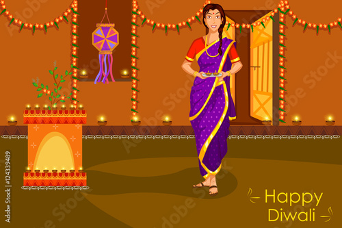 Lady with diya celebrating Diwali festival of India