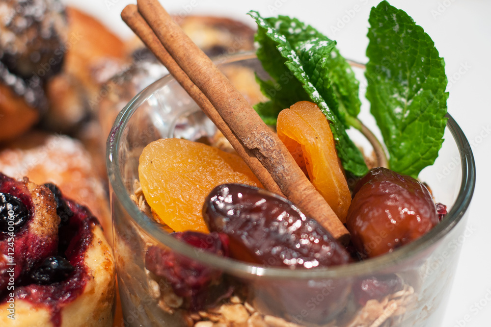 granola with dried apricots, dates, cinnamon and mint with a blu granola with dried apricots, dates, cinnamon and mint with a blu