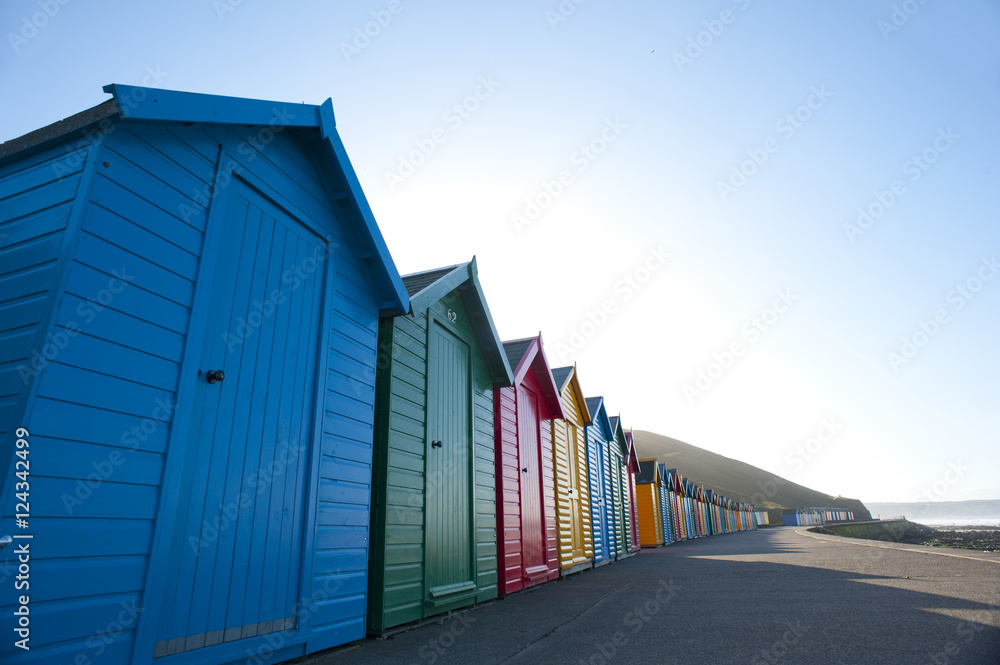 Long perspective shot of colourful beach huts
