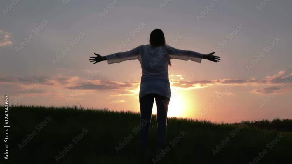 Beautiful pregnant woman raises her hands to the sun at sunset. Beautiful pregnant woman raises her hands to the sun at sunset.