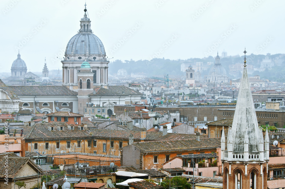 Rome View on architecture. One can see the roofs and domes of cathedrals.