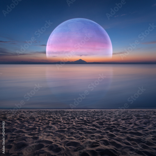 Idyllic fantasy scenery with ocean and planet on horizon