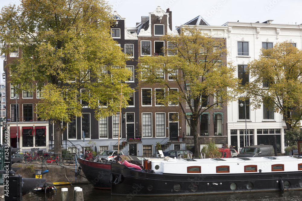 Houseboats and canal houses in Amsterdam