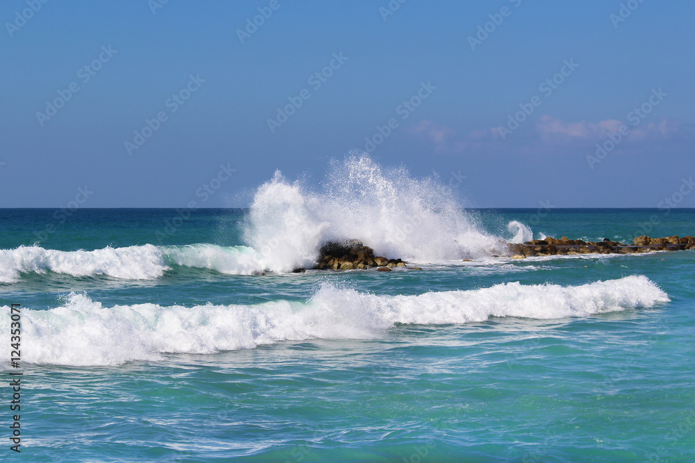 Rocky coastline in Mediterranean sea. Rocks through the water.