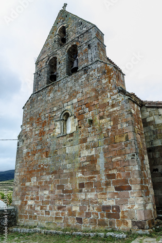 belfry of the Romanesque church of San Cornelio and san Cipriano in the town of San Cebrian of Change in Palencia, Castile and León, Spain photo