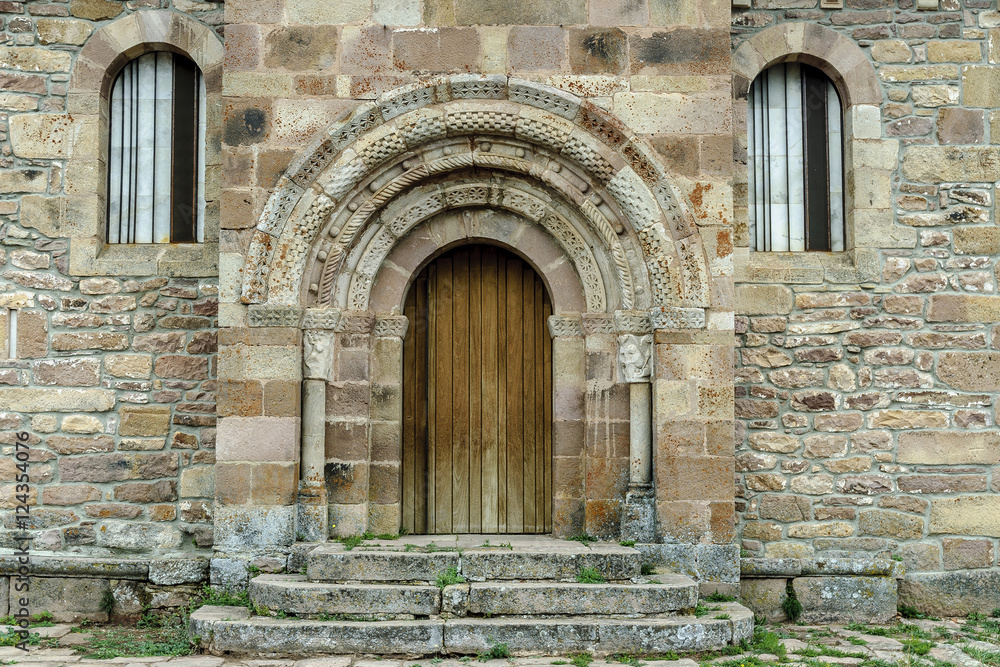 front of the Romanesque church of St Martin Bishop in the Salcedillo town in Palencia, Castile and León, Spain