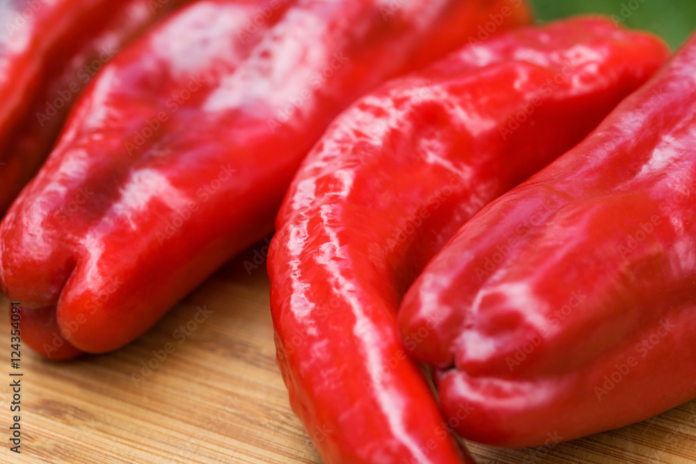 Red fresh pepper fruits on wooden Board
Red fresh pepper fruits on wooden Board