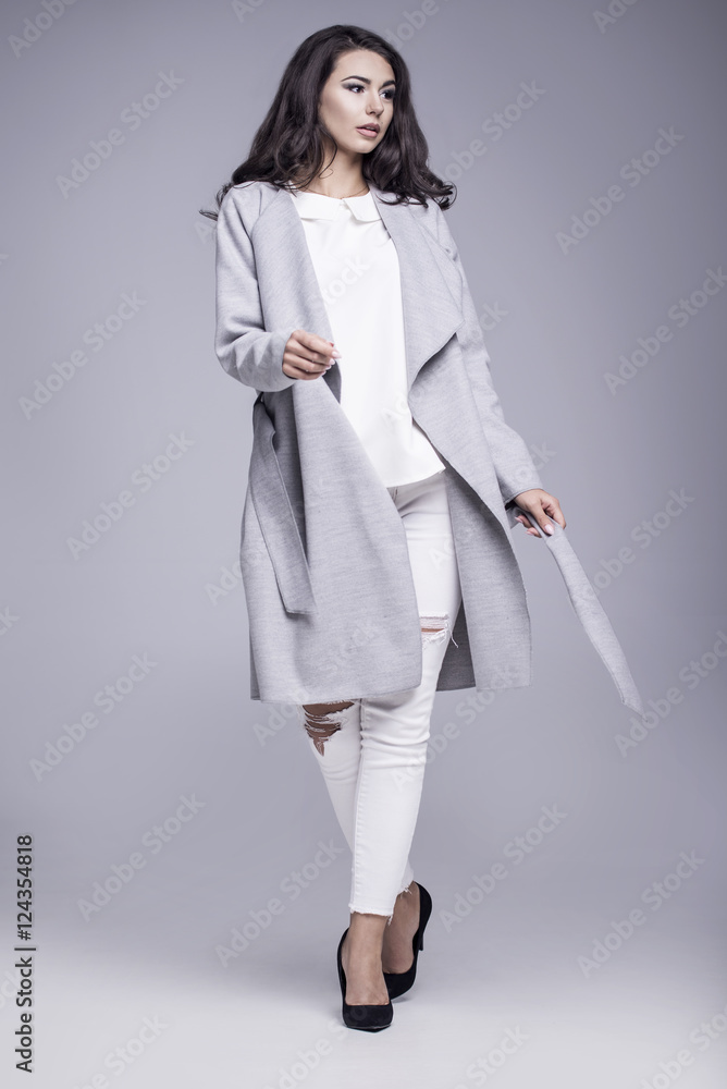 Beautiful young woman in an elegant gray coat Beautiful young woman in an elegant gray coat