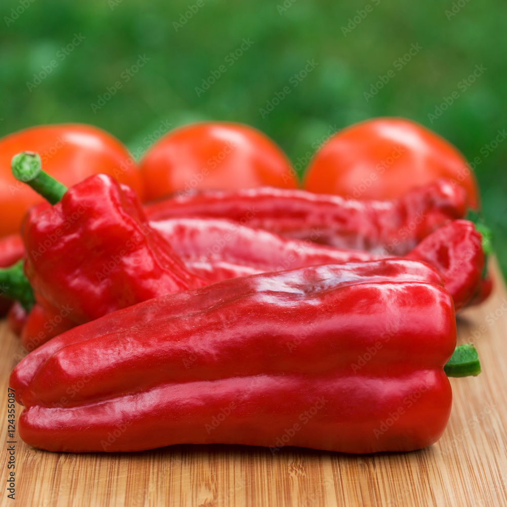 Red fresh pepper fruits on wooden Board
Red fresh pepper fruits on wooden Board