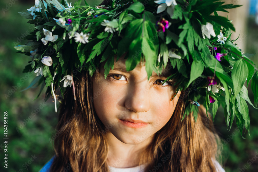 Pretty child girl in a big wreath Pretty child girl in a big wreath