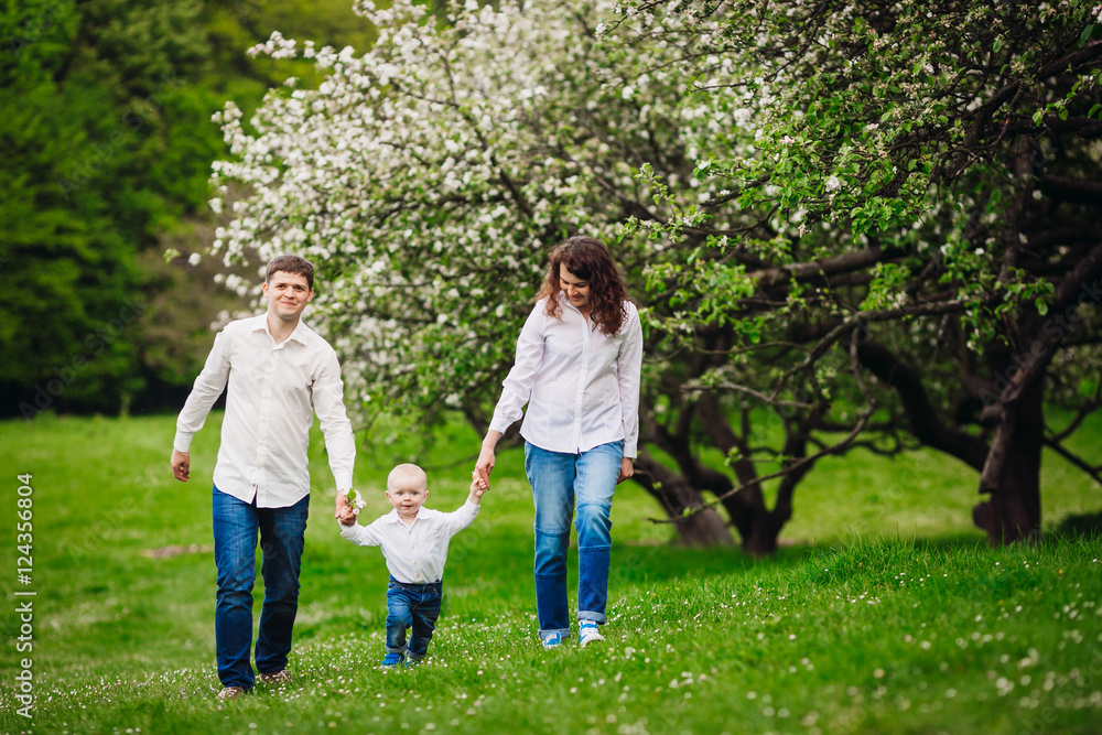 Happy family walki in the park