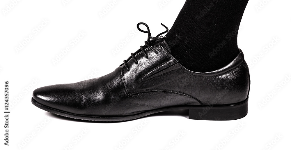 men's leg with a black patent-leather shoes
