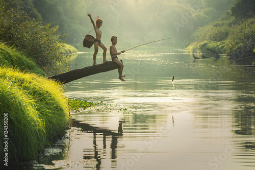 Asian Boy fishing at the river