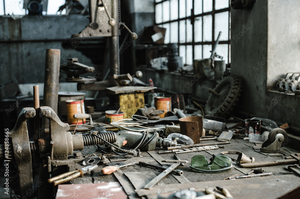 Workbench facing natural light in an old industrial workshop Workbench facing natural light in an old industrial workshop