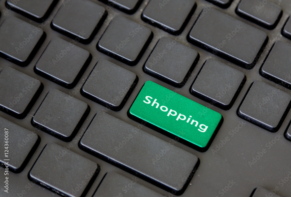 green shopping button on black keypad green shopping button on black keypad