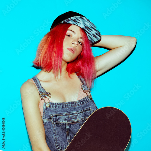 Pretty Teenager girl with pink hair and skateboard Urban Style J photo