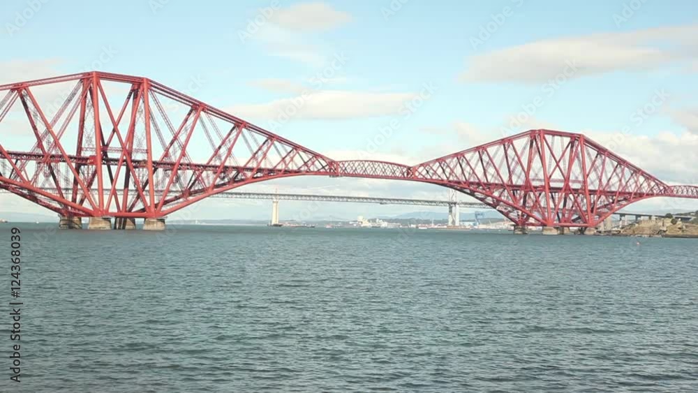 big red metal construction over river, commuters bridge Forth bridge Scotland big red metal construction over river, commuters bridge Forth bridge Scotland