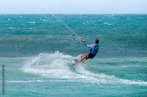 Amazing kite surfing at Philippines. Processional instructor surfing in ocean waives