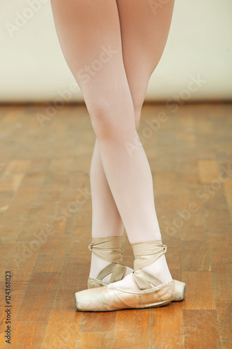 ballerina's legs with ballet shoes.