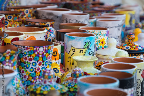 Colorful ceramic pottery on display to be sold © vio0orel