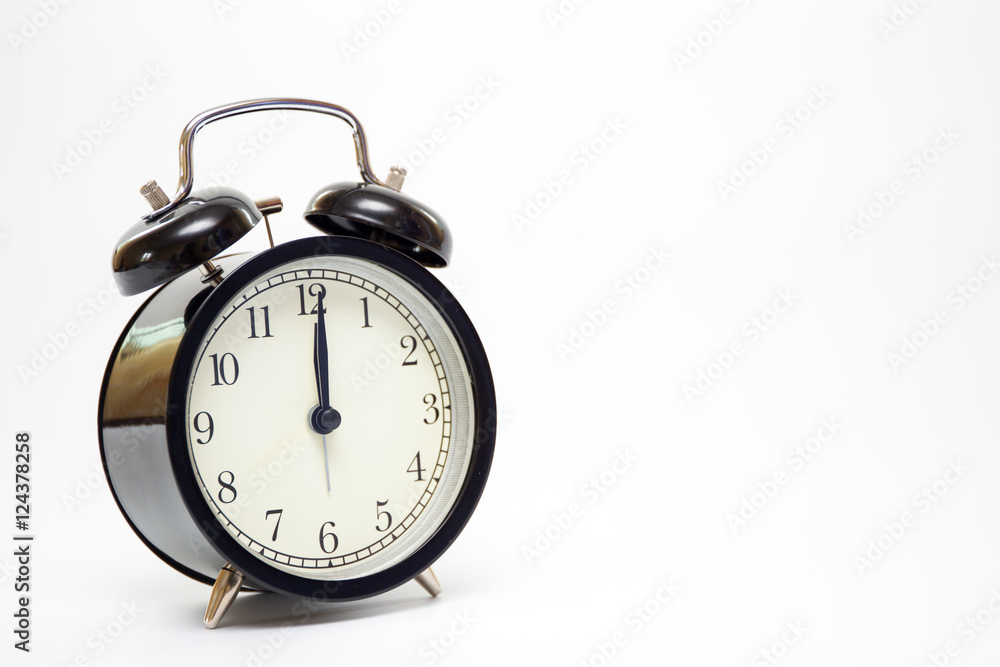 Classic alarm clock on the bed close up. Classic alarm clock on the bed close up.