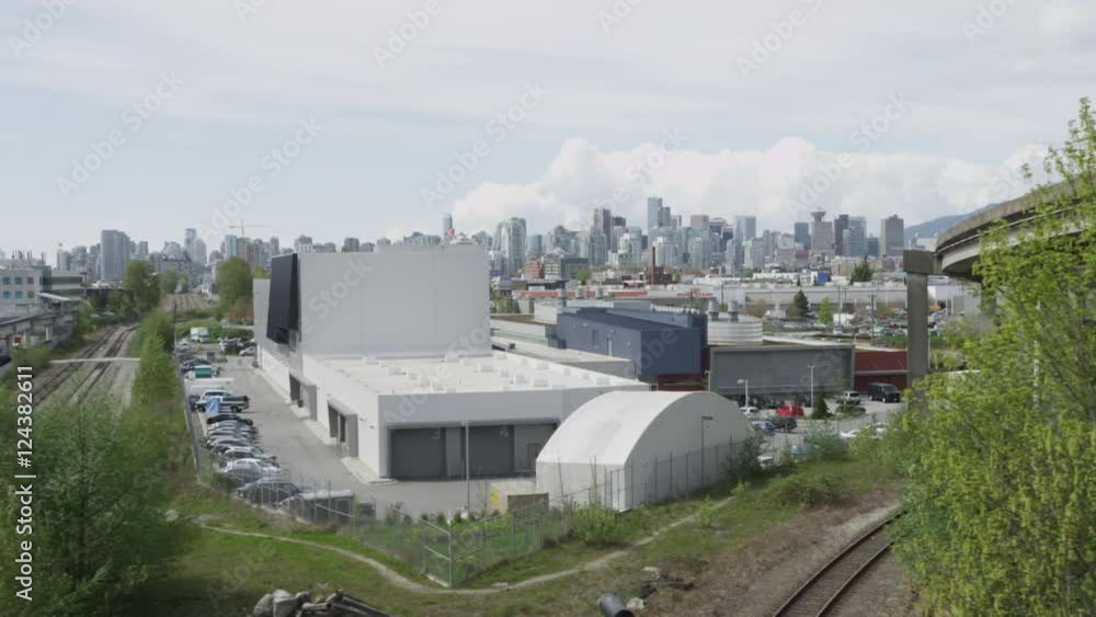Dolly shot of Vancouver skyline with skytrain overpass and station. Dolly shot of Vancouver skyline with skytrain overpass and station.